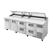 True 119.25-inch commercial refrigerated pizza prep table with storage drawers and refrigerated top.
