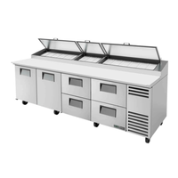 True 119.25-inch commercial refrigerated pizza prep table with storage drawers and refrigerated top.