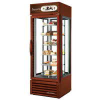 True 27-inch glass dessert display refrigerator showcasing various cakes and pastries on clear rotating shelves.