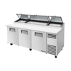 True Refrigeration TPP-AT2-93-HC Solid Door Pizza Preparation Table with cutting surface and storage compartments.