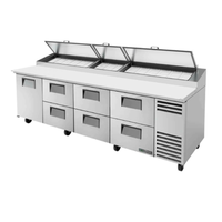 True TPP-AT-119D-6-HC 119-inch commercial pizza prep table with six drawers and two hinged tops.